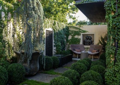 Award-winning Napa Valley estate garden with weeping willow and meticulously maintained plantings.